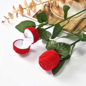 Detail of red rose ring box with velvet flocking and green stem for jewelry display