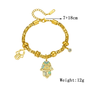 Golden woven wheat chain bracelet with Hamsa hand charms and evil eye enamel pendants