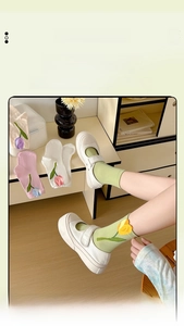 Detailed view of women's cotton socks featuring delicate 3D tulip flower embroidery