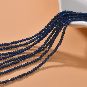 Close-up of faceted 2mm blue crystal beads strands for DIY jewelry making and crafts