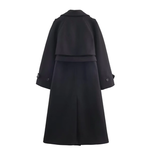 Back view of black long wool coat featuring a trench-style storm flap and belted waist
