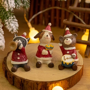 Christmas resin animal band ornaments featuring raccoon and bear on rustic wood base