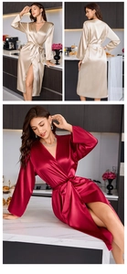 Close-up of silky satin robes in champagne and burgundy with elegant waist tie detail