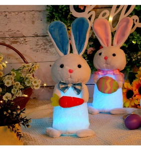 Close-up of glowing plush bunnies with LED lights for Easter and Christmas home decor