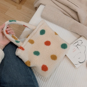 Polka dot plush handbag in off-white faux fur with colorful dots for warm casual use