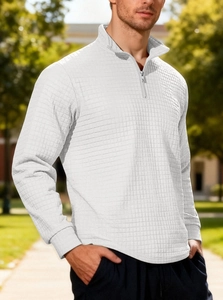 Detail shot of men's white quarter-zip sweatshirt with waffle texture and stand collar