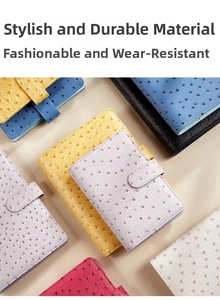 Macro shot of assorted ostrich textured PU leather notebooks with durable buckle closures