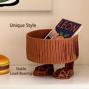 Brown woven storage basket with unique foot shape design for creative home decor