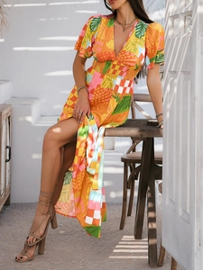 Detail of V-neck print dress with elastic high waist and colorful block pattern