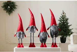 Detail showing four red and grey Christmas gnomes with telescopic legs and plush fabric