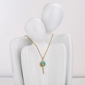 18K gold plated lollipop pendant necklace with blue enamel swirl on white sculptures