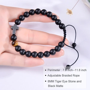 Detail of 8mm matte stone and tiger eye bracelet with cross charm on adjustable cord