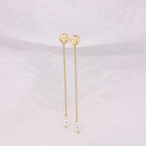 Detail of luxury S925 silver long tassel earrings with gold finish and white pearls
