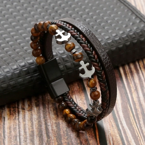 Detail of multi-layer tiger eye stone bracelet with silver anchor and magnetic clasp