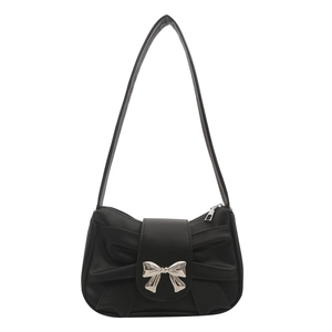 Black matte leather shoulder bag with a large silver metal bow and pleated design
