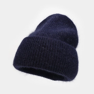 Detail of navy blue angora rabbit hair knit beanie with thick ribbed cuff and fluffy texture