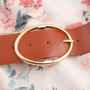 Floral chiffon midi dress styled with a brown leather belt featuring a large gold buckle