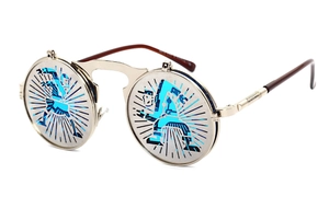Detail of steampunk flip-up sunglasses with silver hollow-carved frames and blue lenses