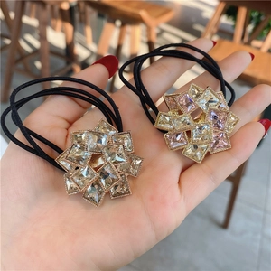Luxurious rhinestone flower hair tie set with geometric crystals on black elastic bands
