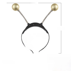 Detail of Halloween alien headband with gold glitter spring balls and LED battery box
