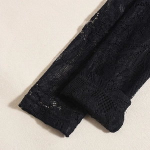 Close-up of intricate black floral lace pattern and delicate hollow texture detail