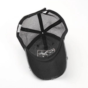 Detail view of the breathable mesh baseball cap with internal labels and washed fabric