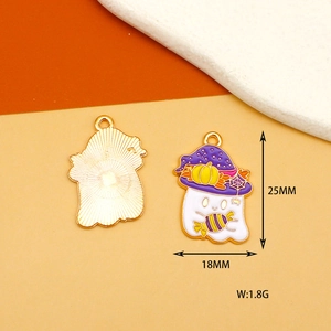 Detail view of ghost pendant with size specs, purple wizard hat and candy for jewelry making