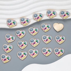 Detailed macro view of colorful heart-shaped enamel charms for DIY jewelry making