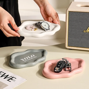 Cloud-shaped ceramic trays in white, grey, and pink for jewelry and small item storage