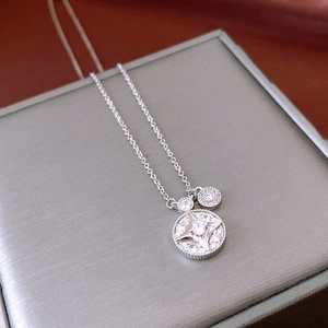 Detailed macro view of silver starburst pendant necklace with sparkling cubic zirconia