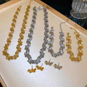 Minimalist butterfly jewelry set with stainless steel necklace and earrings in gold and silver