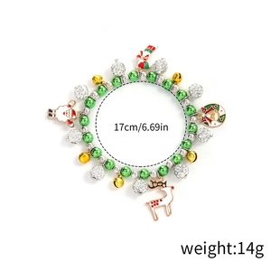 Detailed view of Christmas bracelet with bell, elk, and candy cane charms, 17cm length