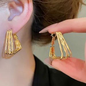 18k gold plated geometric multi-layered twist hoop earrings for women in shiny gold
