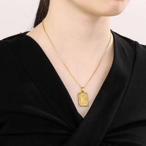 18k gold plated stainless steel rectangle pendant necklace with letter K on model