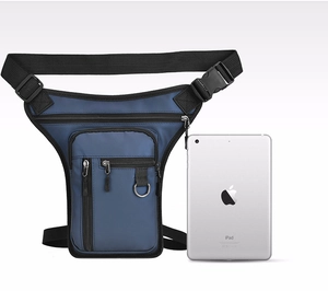 Nylon drop leg bag with multiple pockets compared to a tablet for size reference