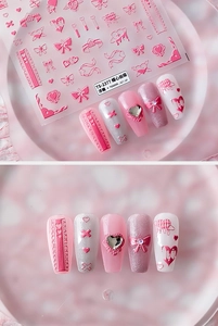 Macro detail of TS-2377 3D embossed nail stickers featuring pink bows and heart designs