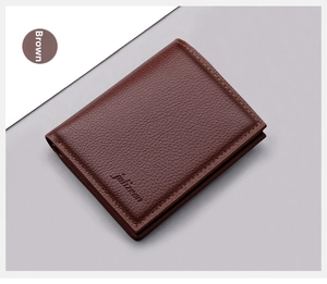 Close-up of brown grain leather texture and embossed logo on vertical slim wallet