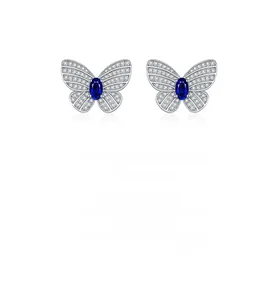 Détail de boucles d'oreilles papillon en argent S925 avec zircons et pierre bleue