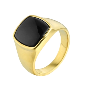 Minimalist gold titanium steel ring with a large square black stone on a white background