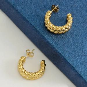 Modern twisted C-shaped earrings in 18k gold plated stainless steel with secure butterfly backs