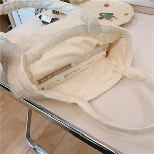 Top view showing the large internal capacity of the white quilted fleece tote bag