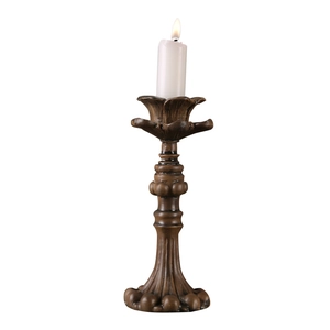 Vintage bronze resin candle holder with lit white candle for romantic table decor