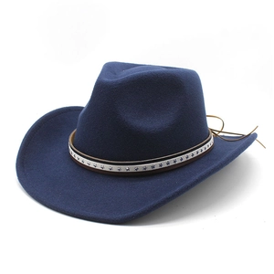 Close-up of wool felt cowboy hat detailing stars band and brown leather adjustment cord