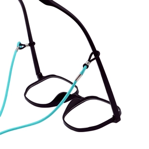 Detail of adjustable blue eyewear strap with silver connector on black glasses frames