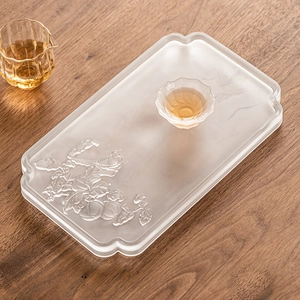 Frosted glass tea tray with embossed bird and pomegranate pattern in a modern design
