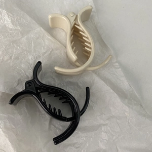 5cm minimalist moon-shaped hair clips in black and cream white on white background
