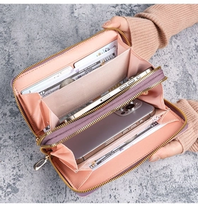 Detailed interior of purple long double zipper wallet with pink compartments for cards