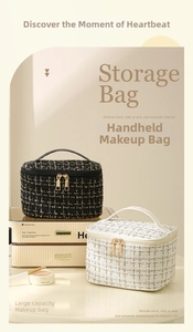 Detail of tweed makeup bags with metal zippers and leather handles in black and white