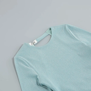 Detail of mint green metallic fabric dress showing neckline and back hook closure