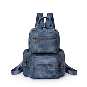 Blue denim casual backpack for women with multiple bronze zipper pockets for travel
